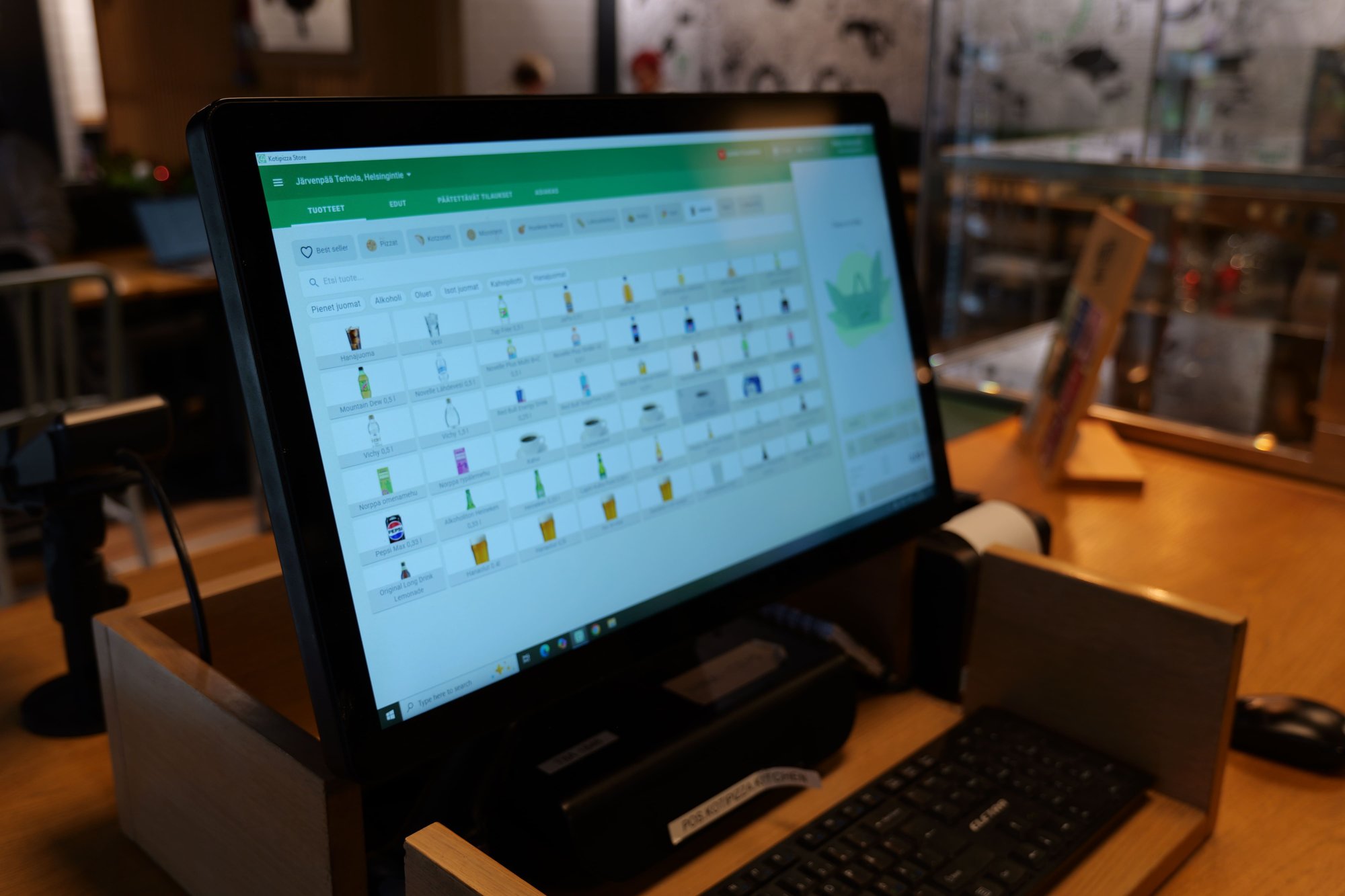 Kuori 21.5-inch POS screen showing the Kotipizza product catalog. Kuori 21.5-inch POS screen showing the Kotipizza product catalog.