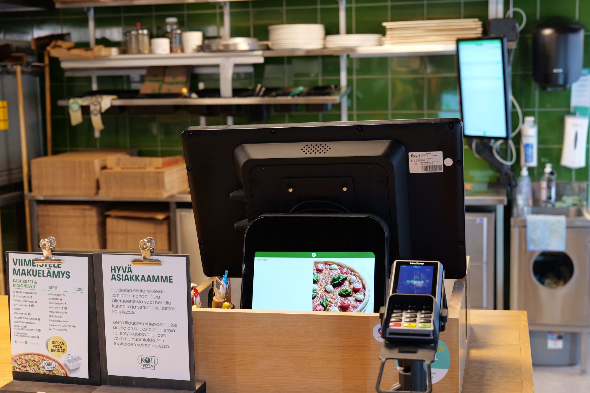 Kuori POS system and payment terminal at a Kotipizza counter. Kuori POS system and payment terminal at a Kotipizza counter.